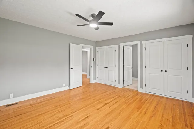 a kitchen with cabinets appliances a sink and a counter top space