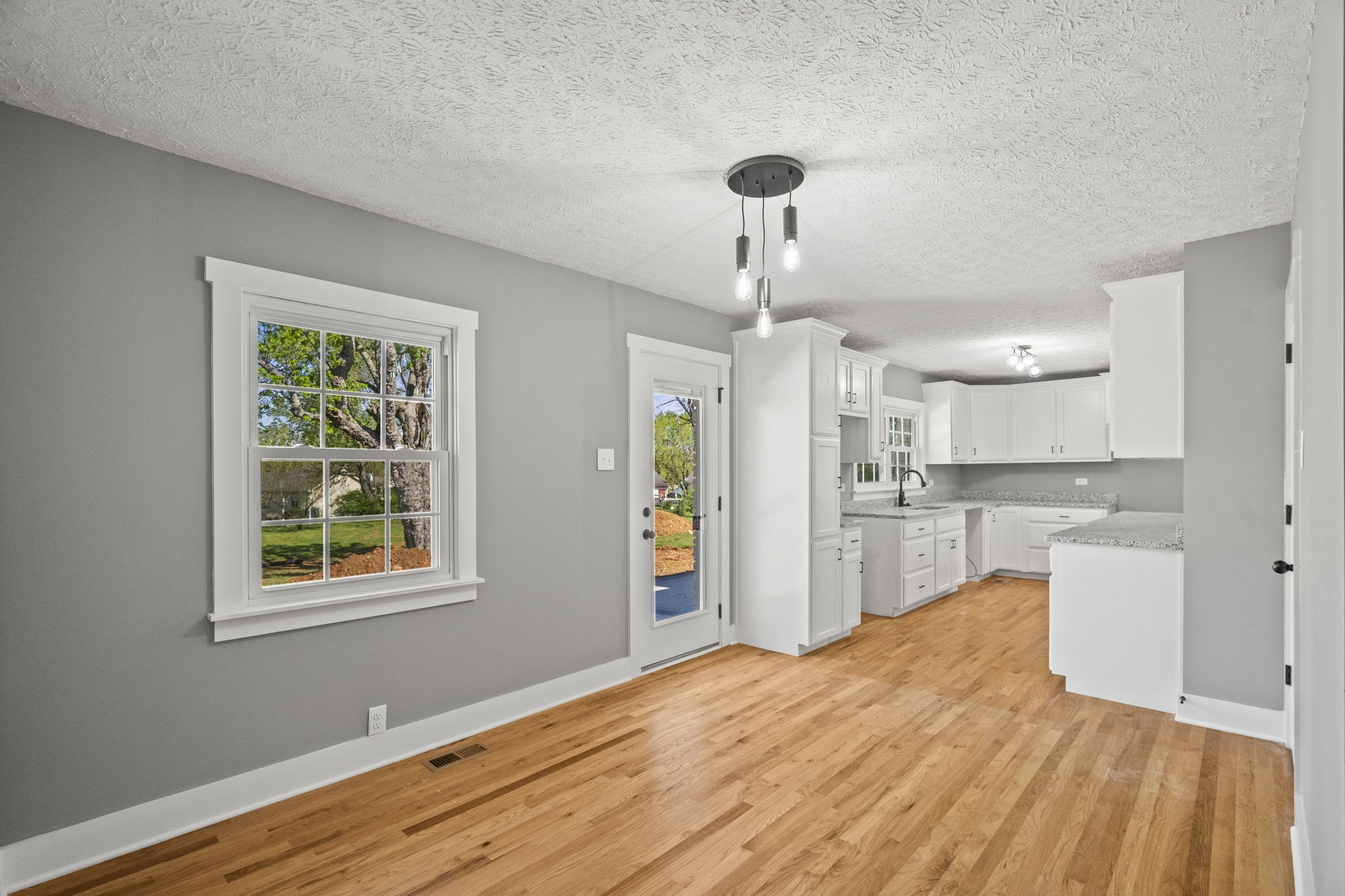 1503 5th Avenue West Springfield, TN 37172 - Photo 27 of 57 a view of a room with wooden floor ceiling fan and windows