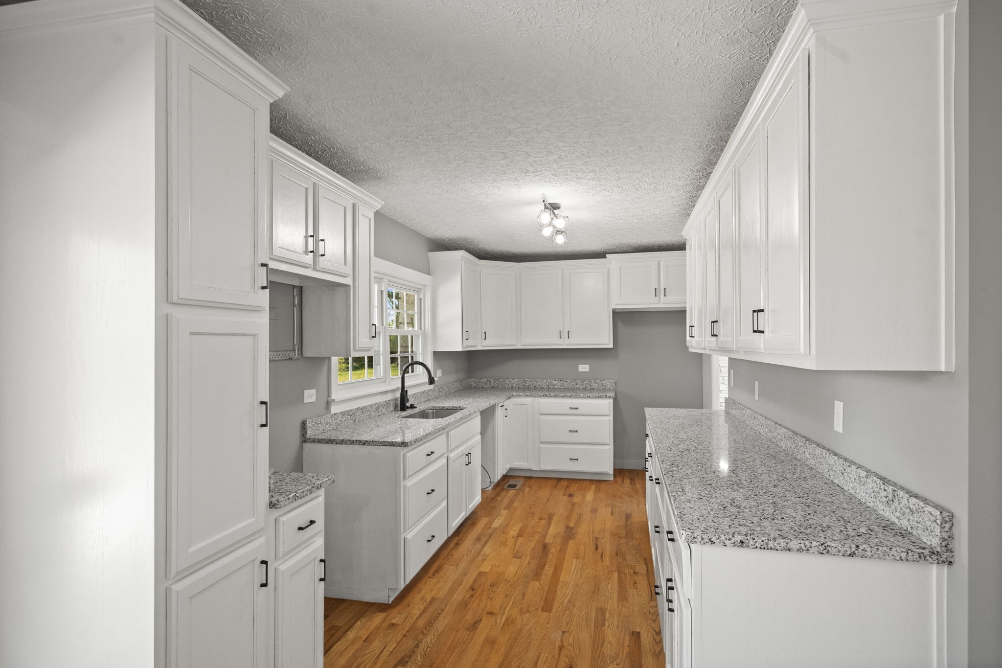 1503 5th Avenue West Springfield, TN 37172 - Photo 29 of 57 a kitchen with cabinets appliances a sink and a counter top space