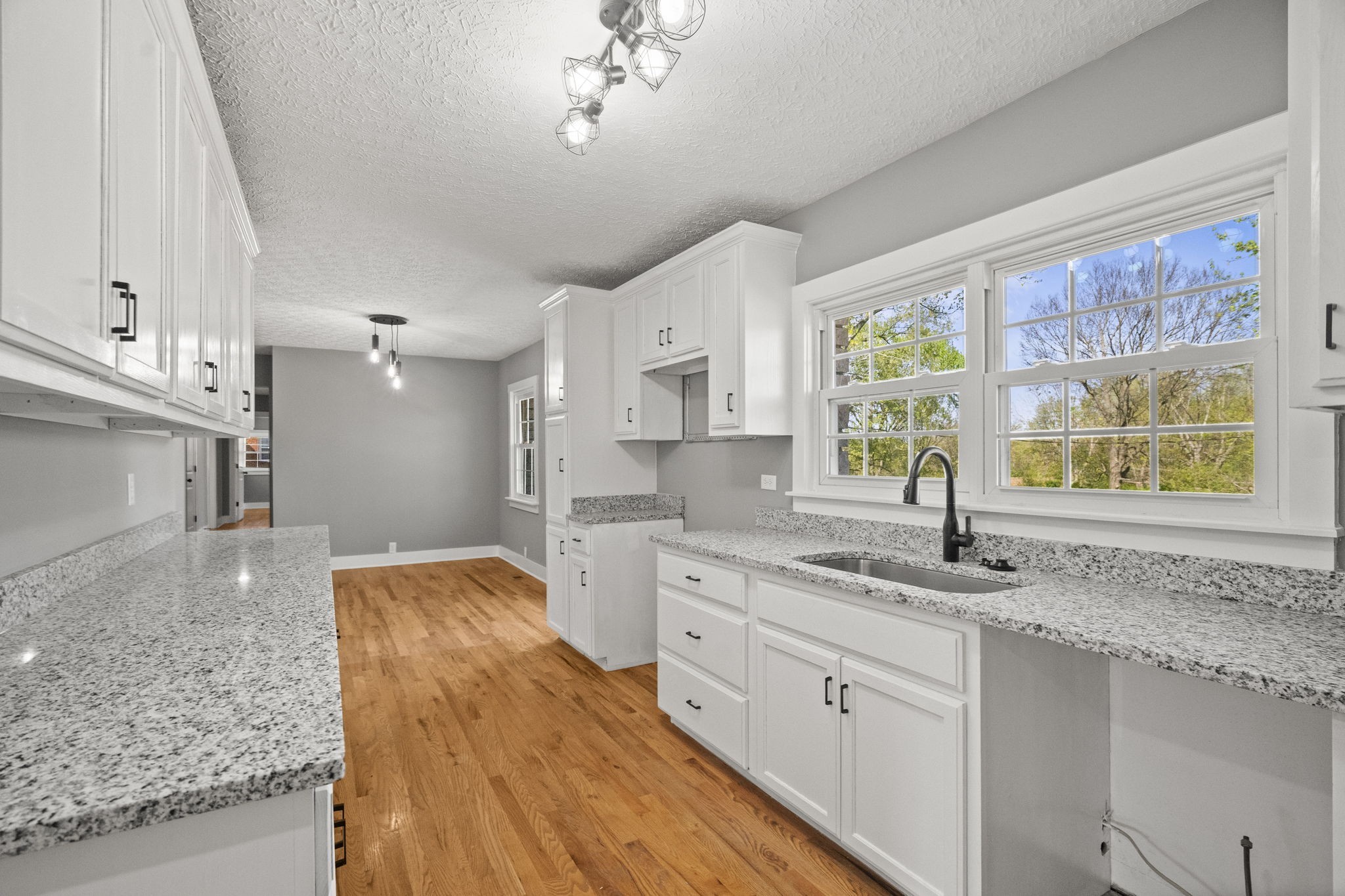 1503 5th Avenue West Springfield, TN 37172 - Photo 34 of 57 a kitchen with stainless steel appliances granite countertop a sink stove and cabinets