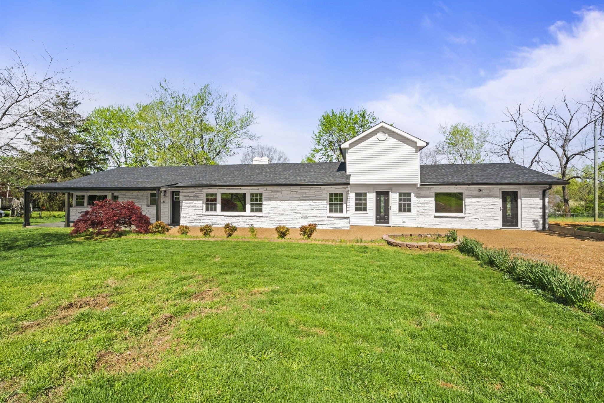 1503 5th Avenue West Springfield, TN 37172 - Photo 4 of 57 a front view of a house with a garden