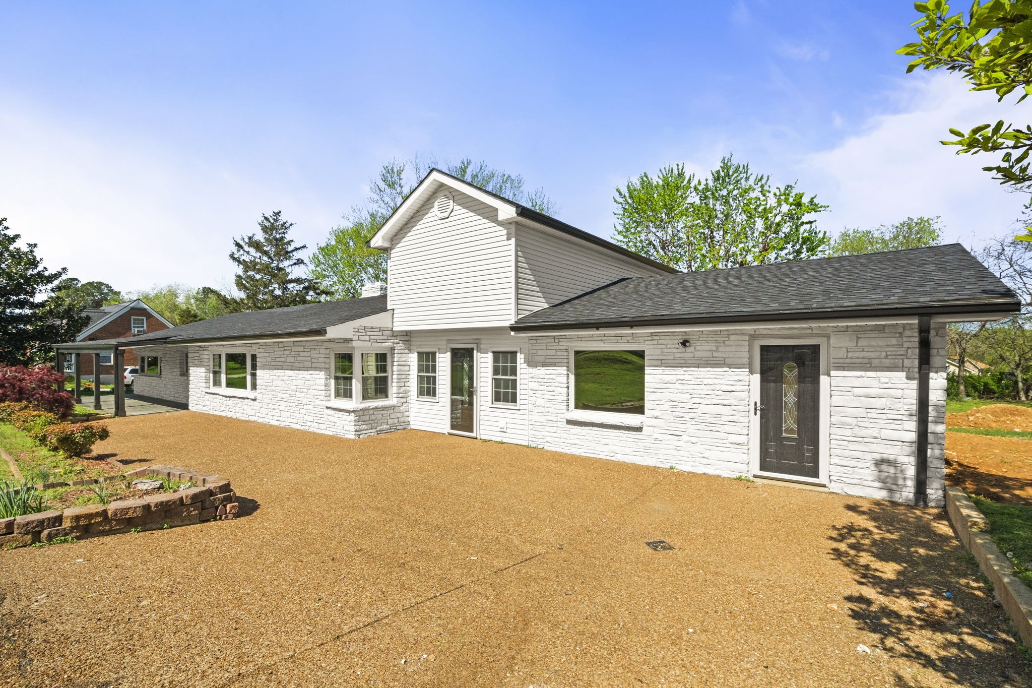 1503 5th Avenue West Springfield, TN 37172 - Photo 5 of 57 a front view of a house with a yard and garage