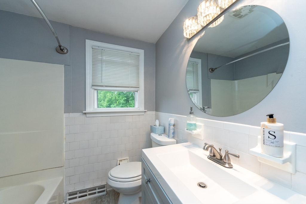 13 Westgate Road Framingham, MA 01701 - Photo 11 of 24 a bathroom with a sink toilet and a mirror