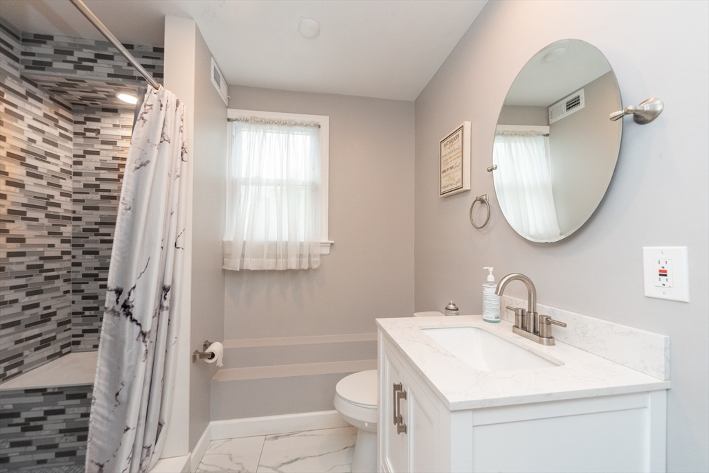13 Westgate Road Framingham, MA 01701 - Photo 14 of 24 a bathroom with a sink toilet and shower