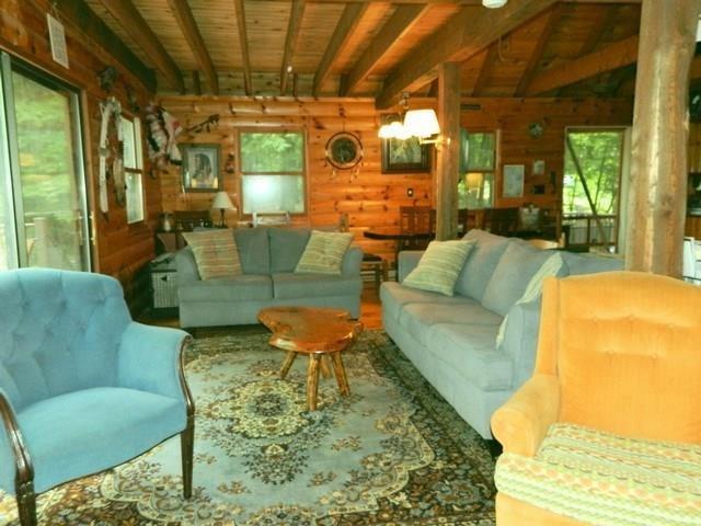 38-40 Blackberry Estates Rome, ME 04963 - Photo 13 of 23 LIving room with sliders to the wrap...