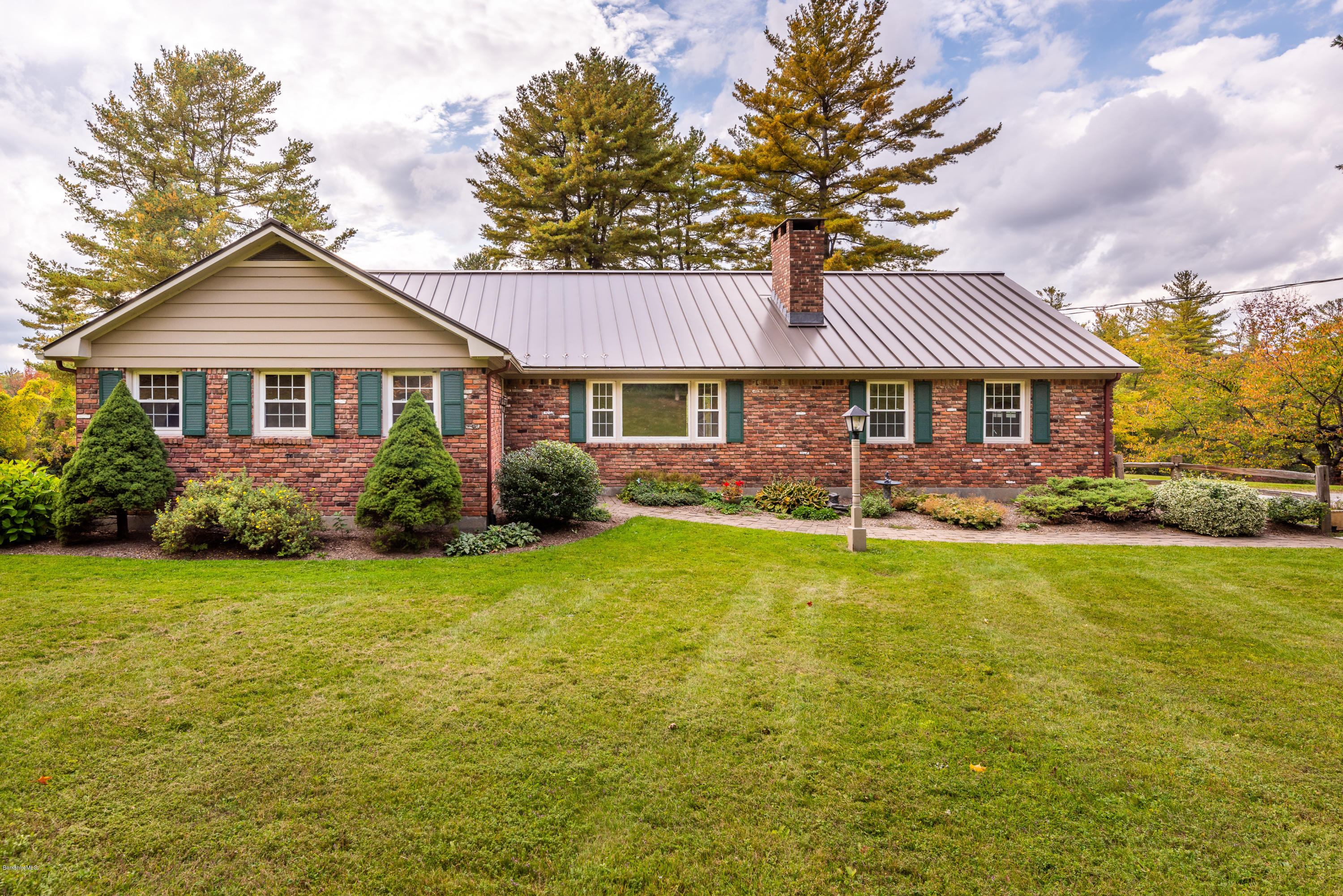 552 E Road Richmond, MA 01254 - Photo 2 of 42 a front view of a house with a garden and trees