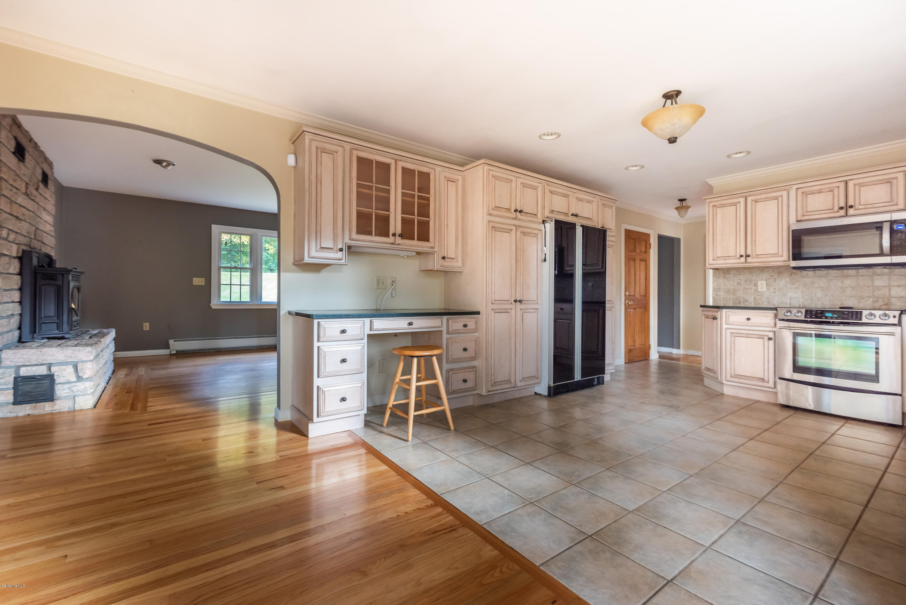 552 E Road Richmond, MA 01254 - Photo 14 of 42 a kitchen with stainless steel appliances granite countertop a refrigerator and a stove top oven