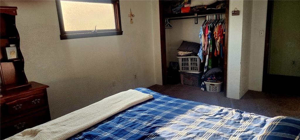 903 Clearfield Road Fenelton, PA 16034 - Photo 14 of 25 a bedroom with bed and a window