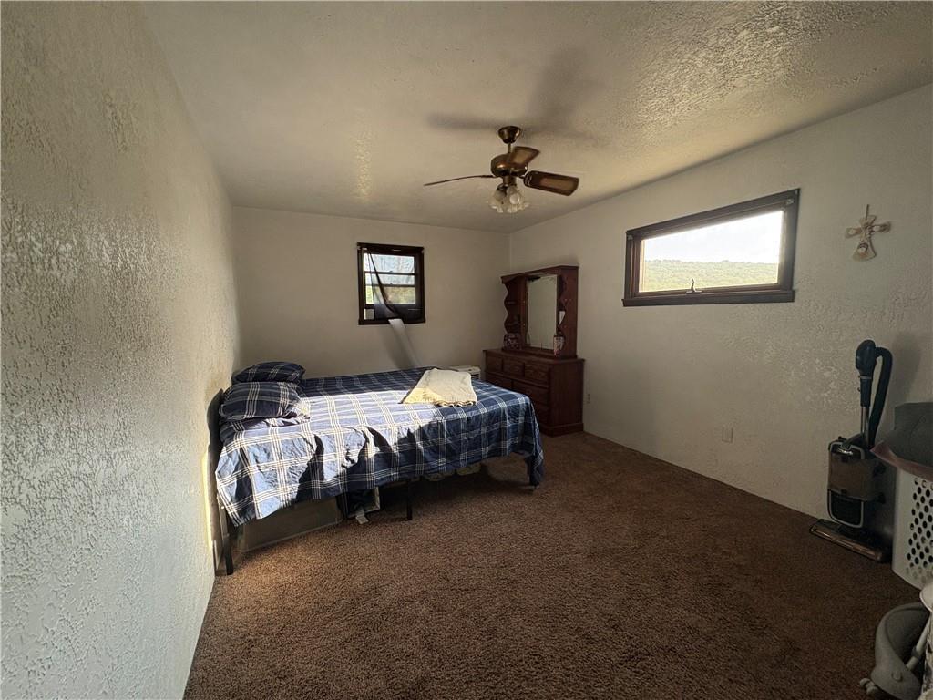 903 Clearfield Road Fenelton, PA 16034 - Photo 15 of 25 a bed sitting in a bedroom next to a window