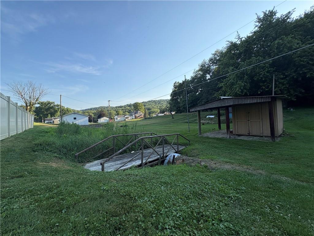 903 Clearfield Road Fenelton, PA 16034 - Photo 23 of 25 a view of a wooden deck and bench