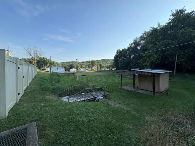 a view of a couches in backyard of the house