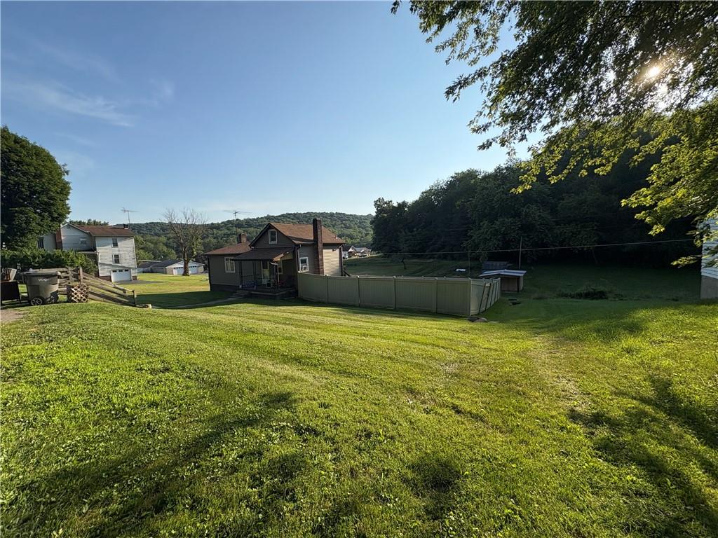 903 Clearfield Road Fenelton, PA 16034 - Photo 4 of 25 a backyard of a house with lots of green space
