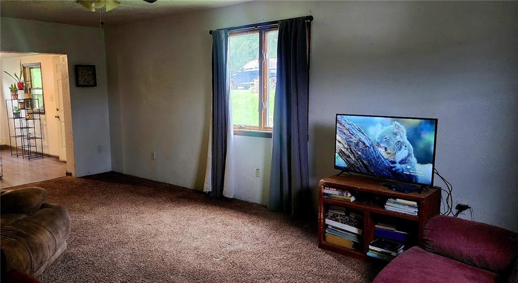 903 Clearfield Road Fenelton, PA 16034 - Photo 8 of 25 an empty room with furniture and a window