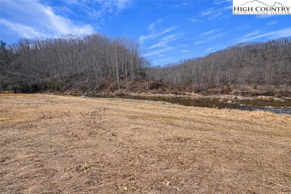 a view of side of snow with a yard