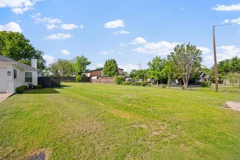 a view of a house with a big yard