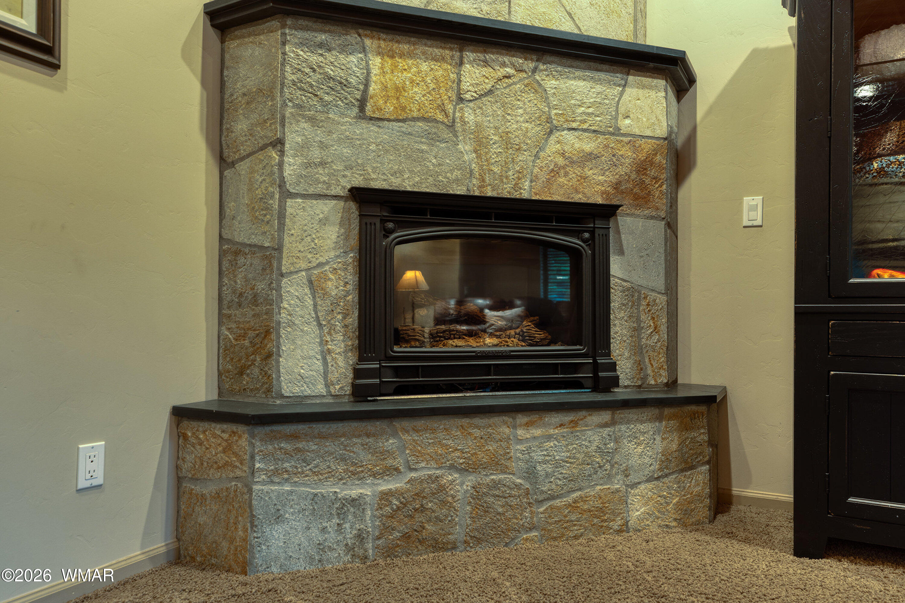 5155 Buck Springs Road Pinetop, AZ 85935 - Photo 15 of 37 a living room with a fireplace