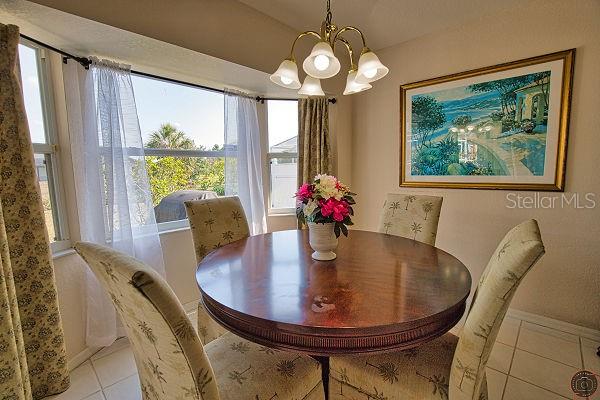 116 Albatross Road Rotonda West, FL 33947 - Photo 15 of 28 a view of a dining room with furniture window and outside view