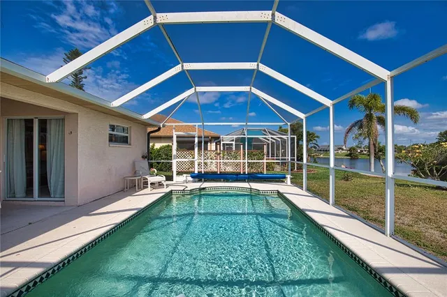 a view of a backyard with sitting area and furniture