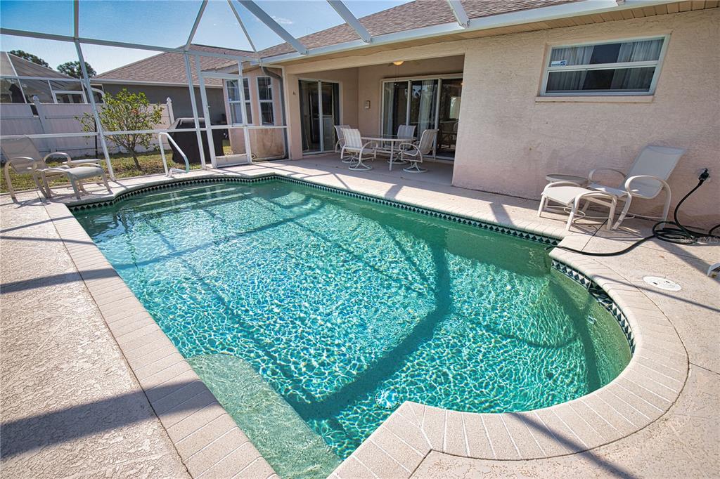 116 Albatross Road Rotonda West, FL 33947 - Photo 26 of 28 a view of a backyard with sitting area and furniture