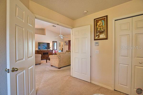 116 Albatross Road Rotonda West, FL 33947 - Photo 8 of 28 a living room with furniture and a flat screen tv