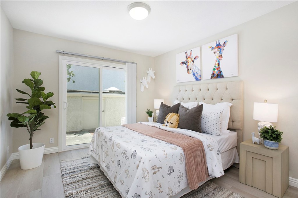 19 Spinnaker Irvine, CA 92614 - Photo 18 of 63 a bedroom with a large bed and a potted plant