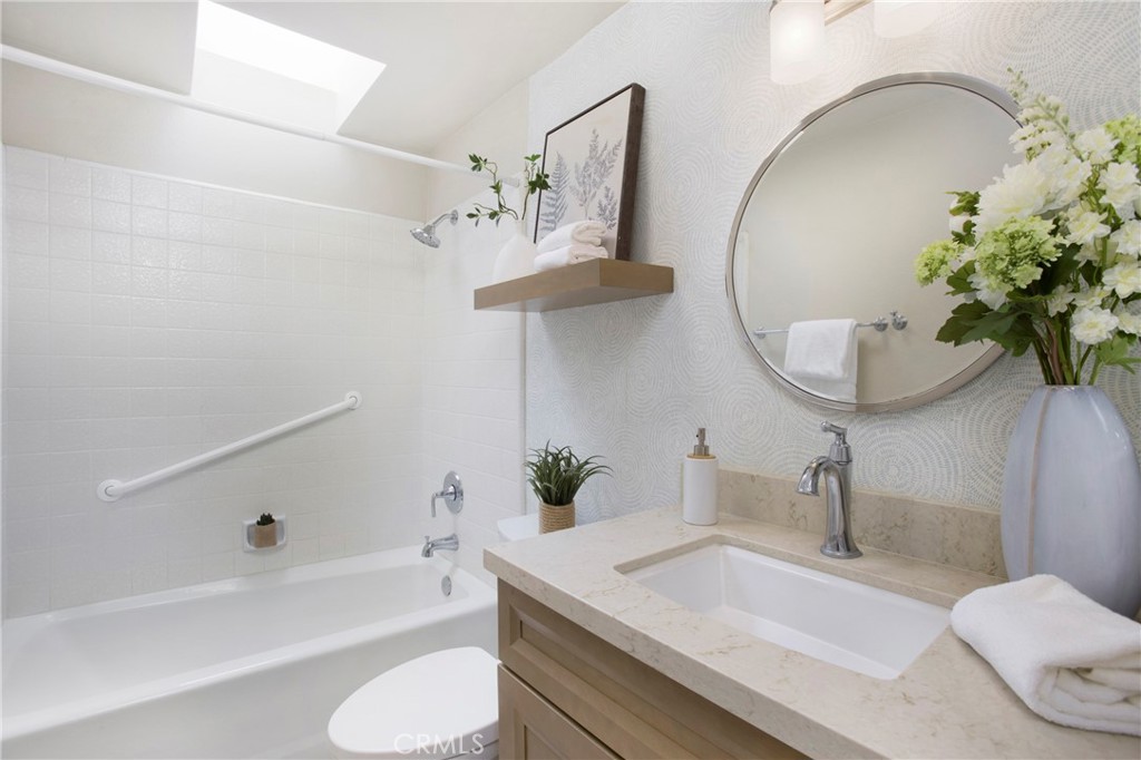 19 Spinnaker Irvine, CA 92614 - Photo 19 of 63 a bathroom with a sink a toilet and bathtub
