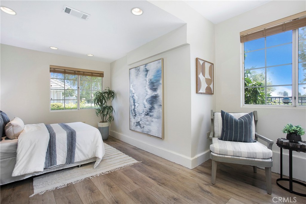 19 Spinnaker Irvine, CA 92614 - Photo 21 of 63 a spacious bedroom with a large bed and a couch