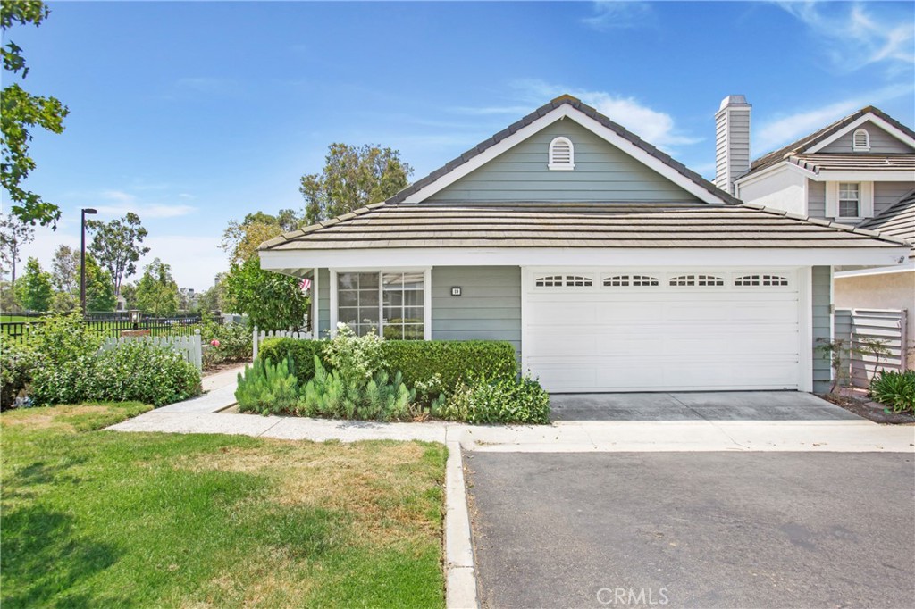 19 Spinnaker Irvine, CA 92614 - Photo 24 of 63 a front view of a house with garden