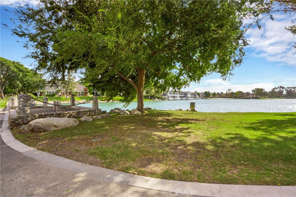 19 Spinnaker Irvine, CA 92614 - Photo 37 of 63 a view of a swimming pool with an outdoor space and seating area