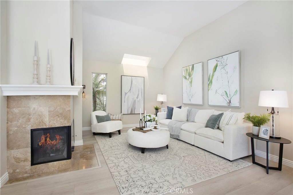 19 Spinnaker Irvine, CA 92614 - Photo 7 of 63 a living room with furniture and a fireplace