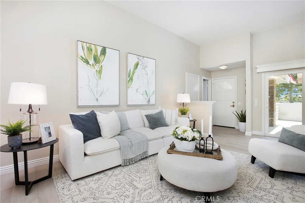 19 Spinnaker Irvine, CA 92614 - Photo 9 of 63 a living room with furniture and a large window