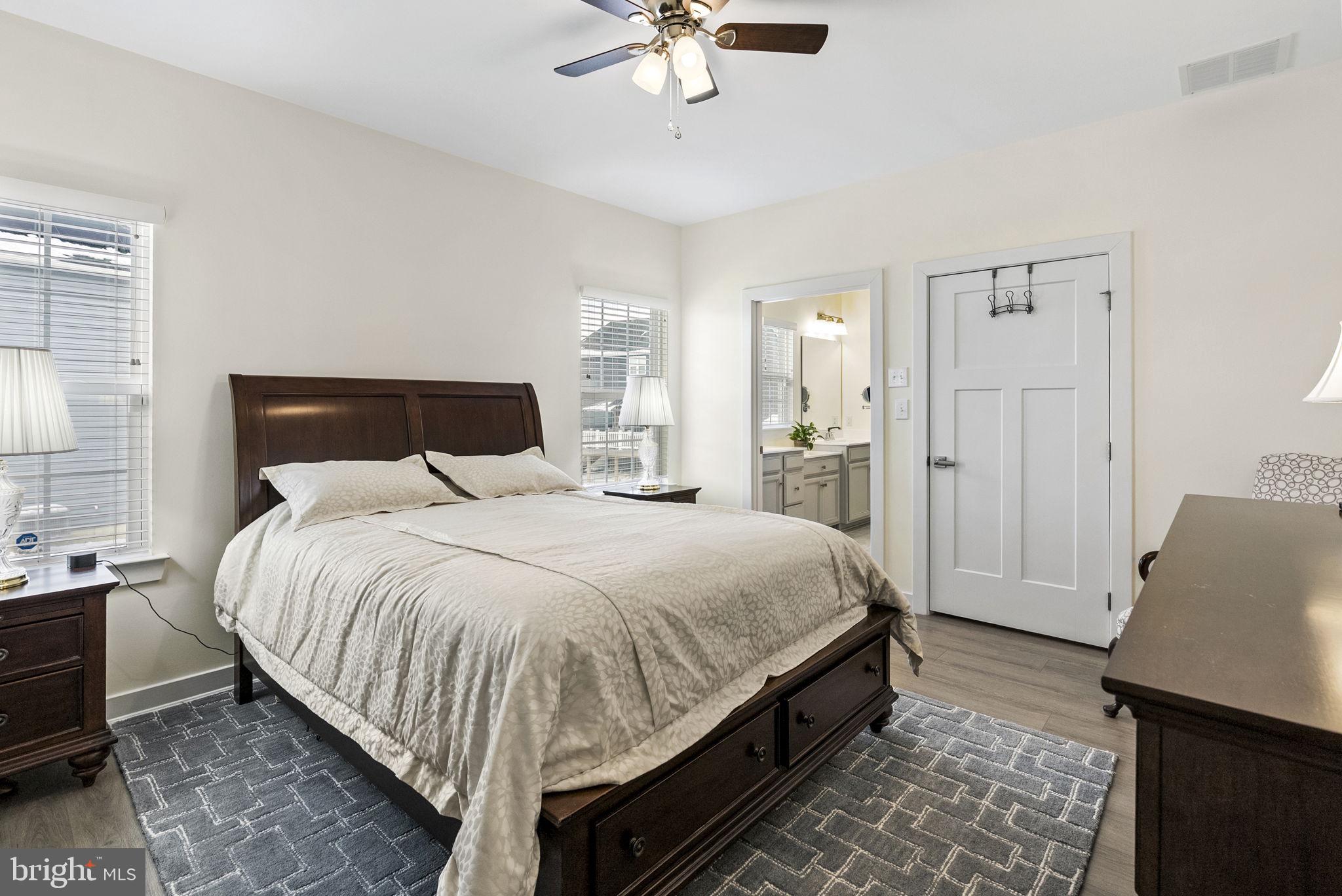 112 Frame Drive Coatesville, PA 19320 - Photo 25 of 55 a large bed sitting in a bedroom and a chandelier