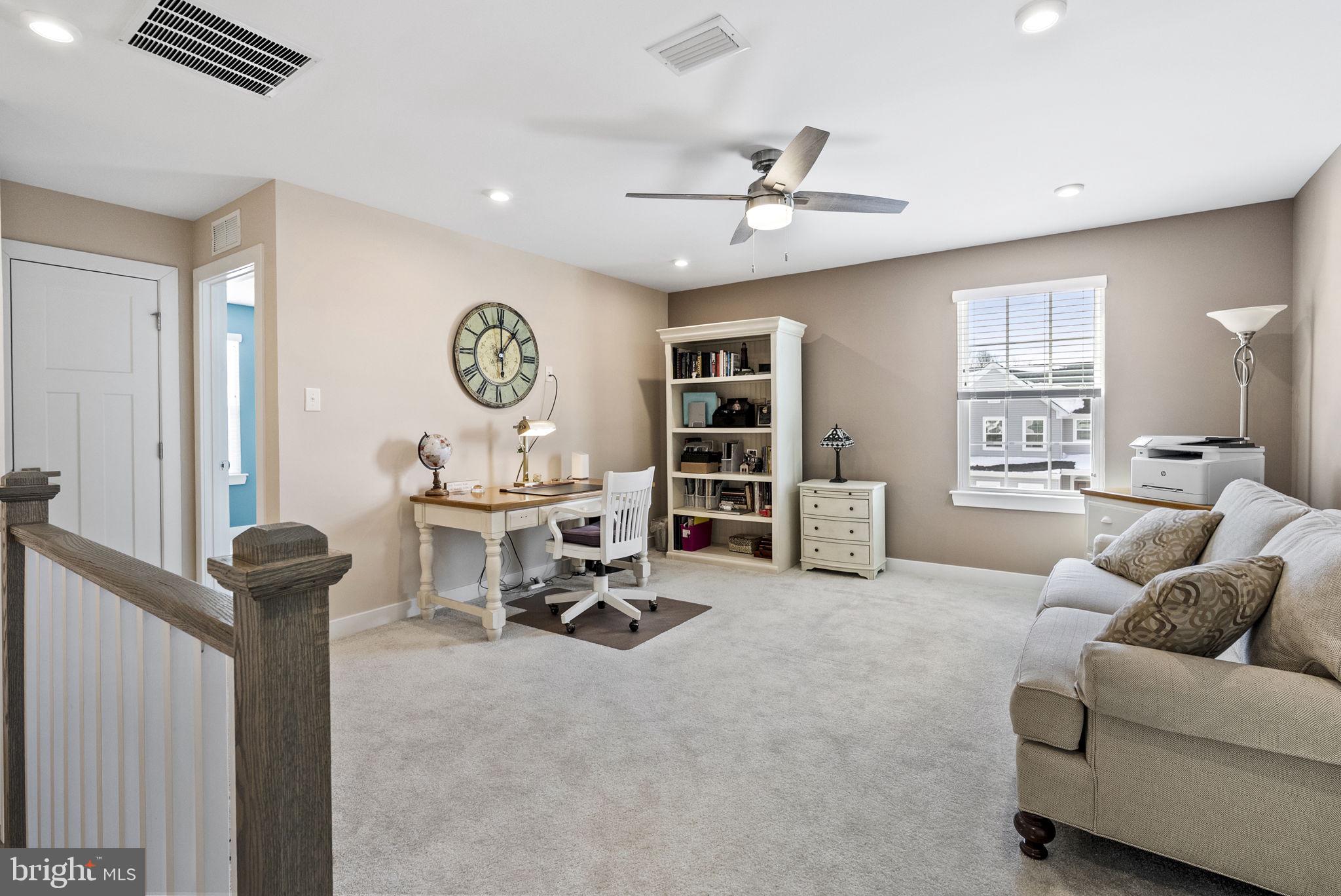 112 Frame Drive Coatesville, PA 19320 - Photo 31 of 55 a living room with furniture a window and a chandelier