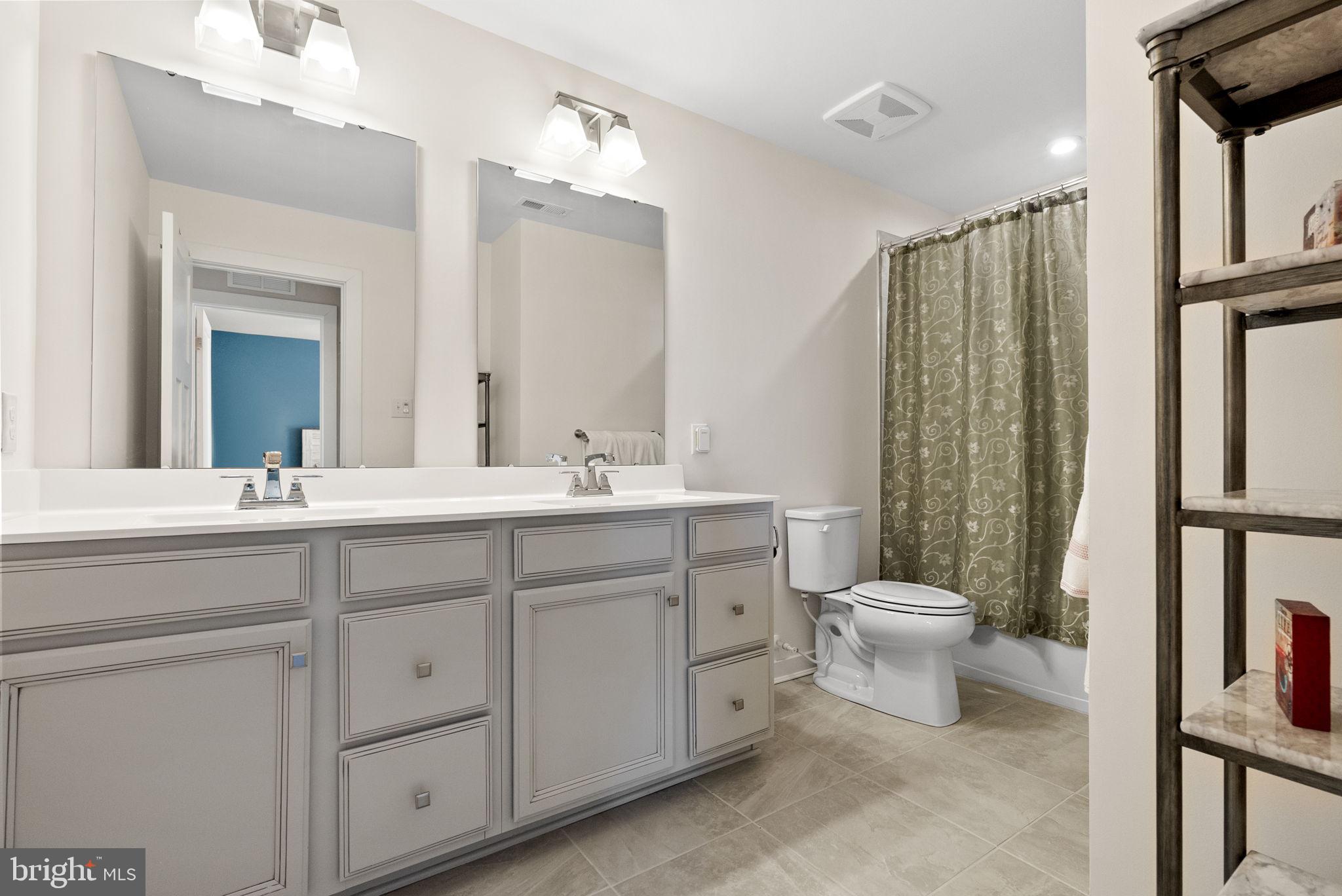 112 Frame Drive Coatesville, PA 19320 - Photo 33 of 55 a bathroom with a double vanity sink toilet and shower