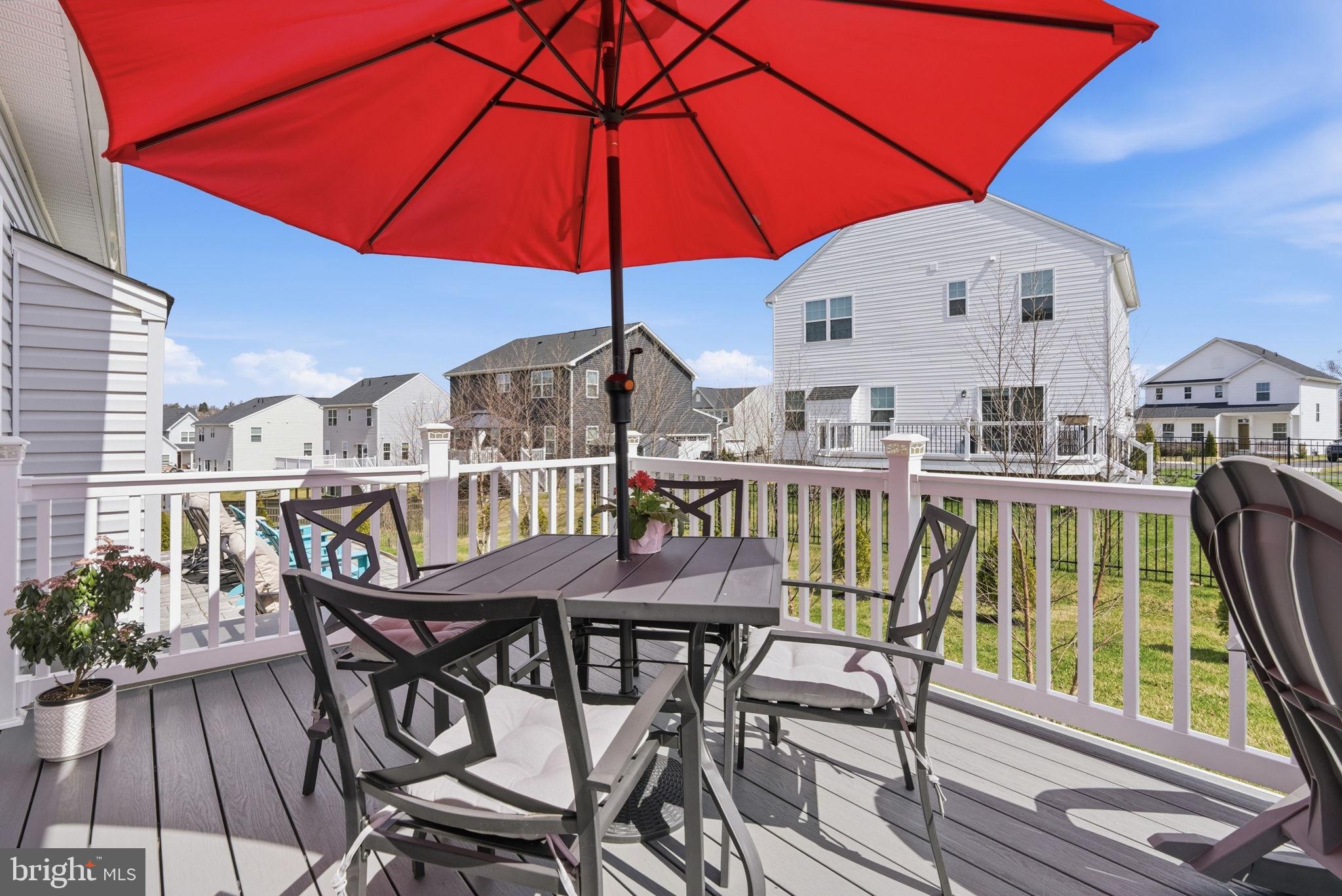 112 Frame Drive Coatesville, PA 19320 - Photo 41 of 55 a view of a roof deck with table and chairs under an umbrella