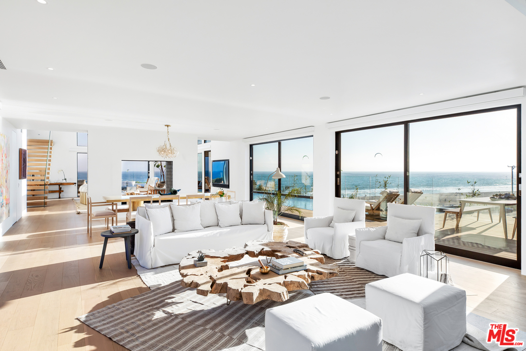 6463 Surfside Way Malibu, CA 90265 - Photo 11 of 31 a living room with furniture and a large window