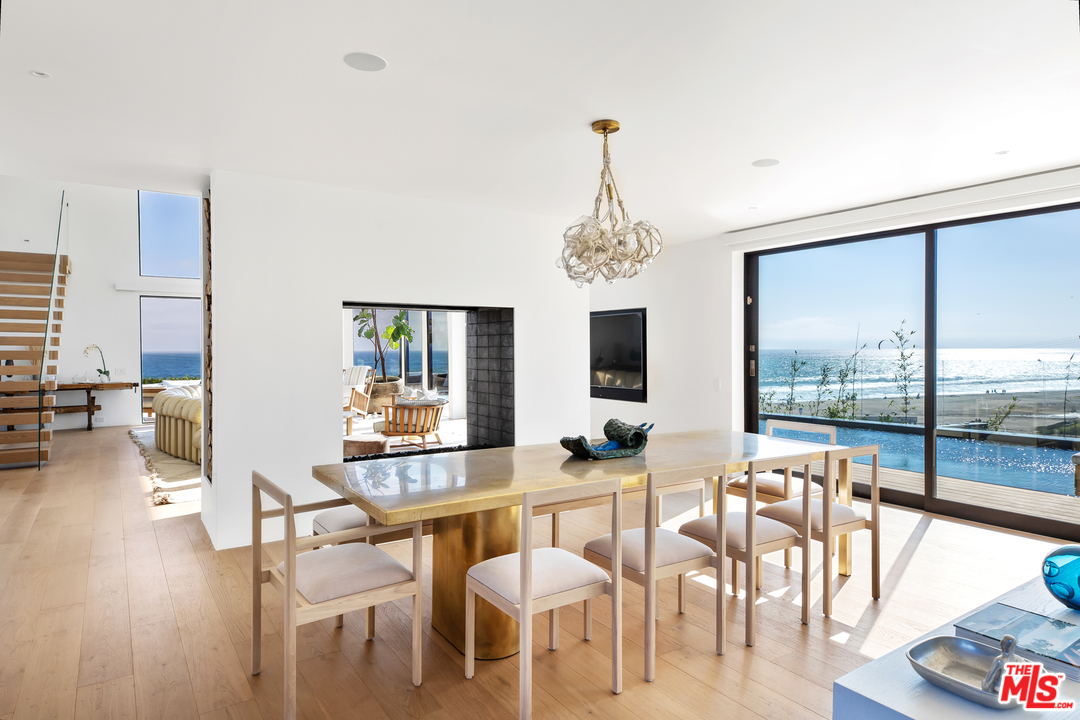 6463 Surfside Way Malibu, CA 90265 - Photo 12 of 31 a view of a dining room with furniture window and wooden floor