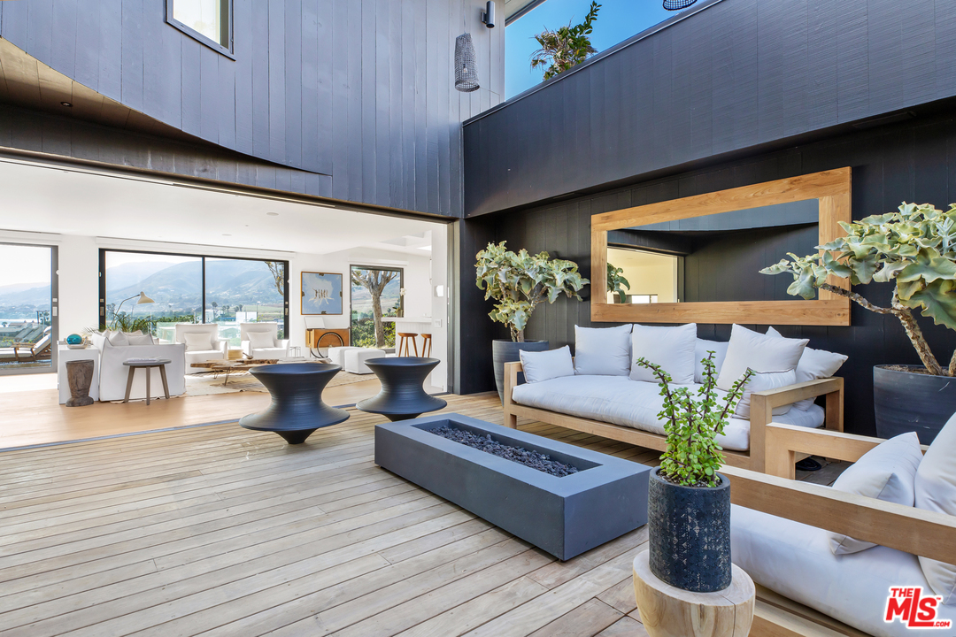 6463 Surfside Way Malibu, CA 90265 - Photo 18 of 31 a living room with furniture and a large window