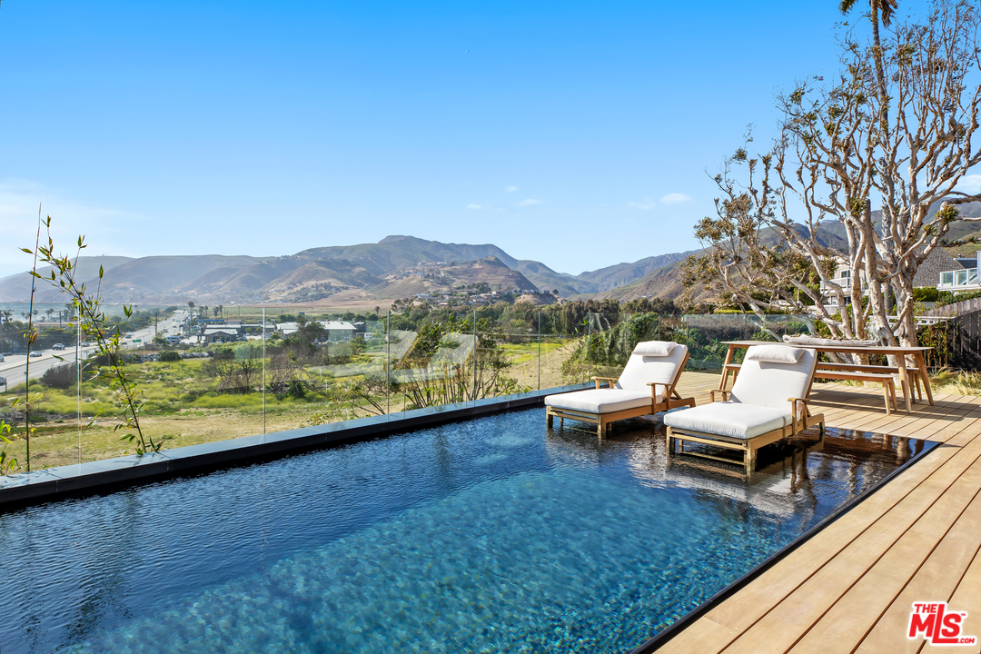 6463 Surfside Way Malibu, CA 90265 - Photo 19 of 31 a view of swimming pool with lounge chair and lake view