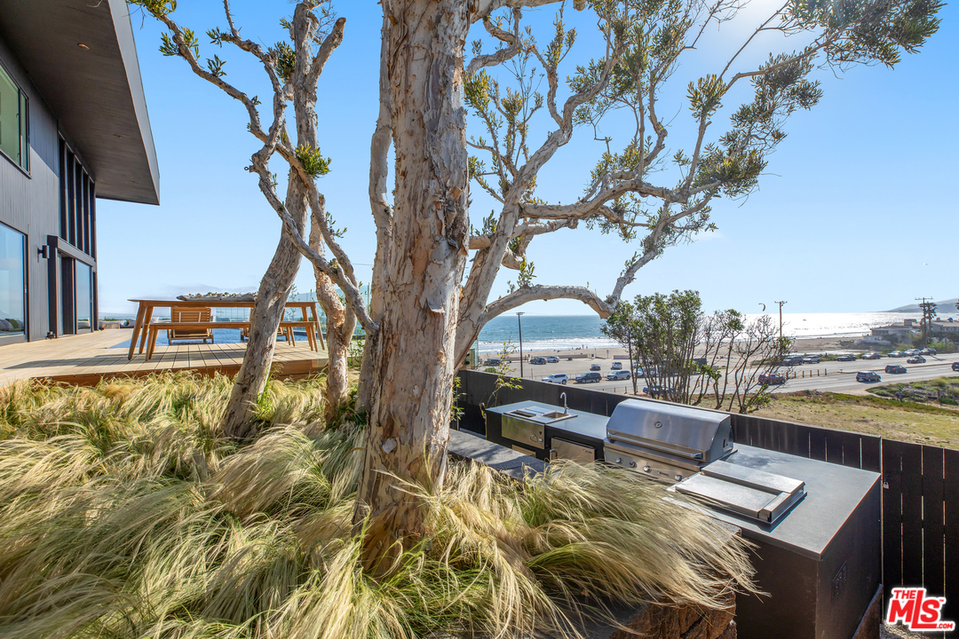 6463 Surfside Way Malibu, CA 90265 - Photo 20 of 31 a view of a swimming pool with a patio