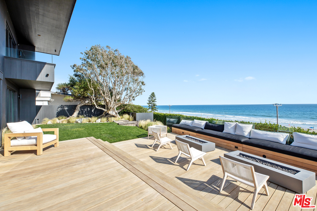 6463 Surfside Way Malibu, CA 90265 - Photo 22 of 31 a view of a terrace with chairs
