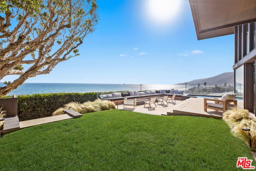 6463 Surfside Way Malibu, CA 90265 - Photo 23 of 31 a view of a garden with lawn chairs