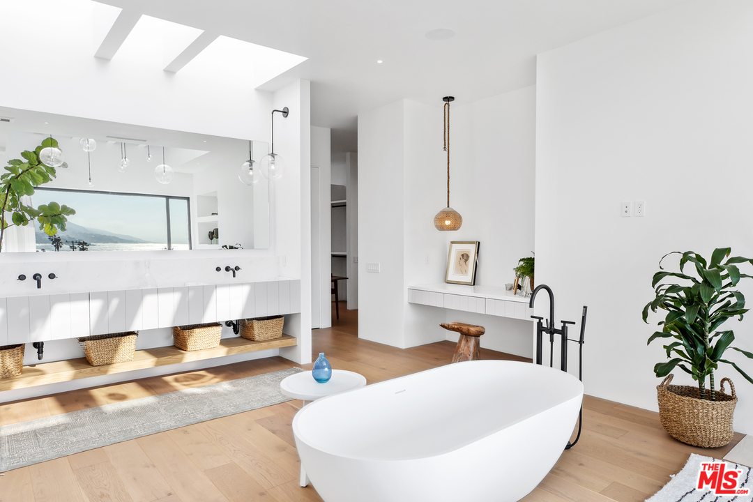 6463 Surfside Way Malibu, CA 90265 - Photo 28 of 31 a living room with furniture and a potted plant