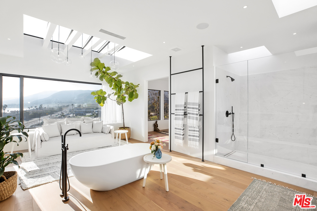 6463 Surfside Way Malibu, CA 90265 - Photo 29 of 31 a spacious bathroom with a bathtub and a shower