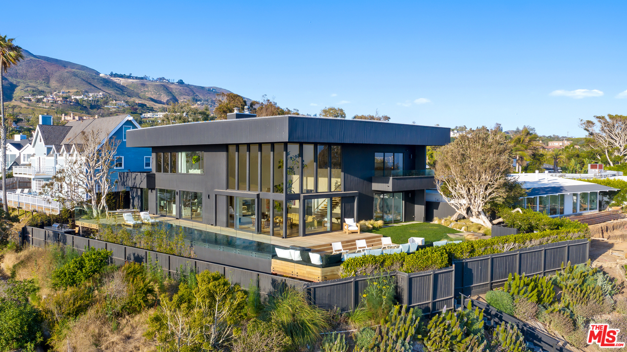 6463 Surfside Way Malibu, CA 90265 - Photo 4 of 31 a view of a house with swimming pool and sitting area