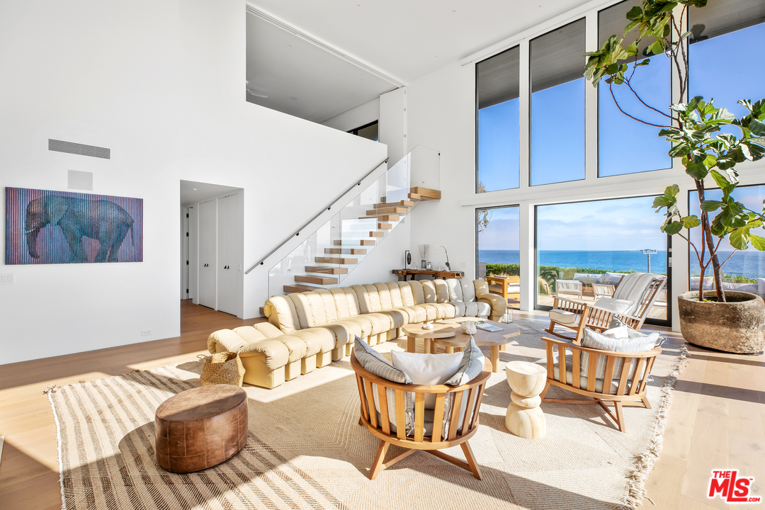 6463 Surfside Way Malibu, CA 90265 - Photo 8 of 31 a living room with furniture and wooden floor