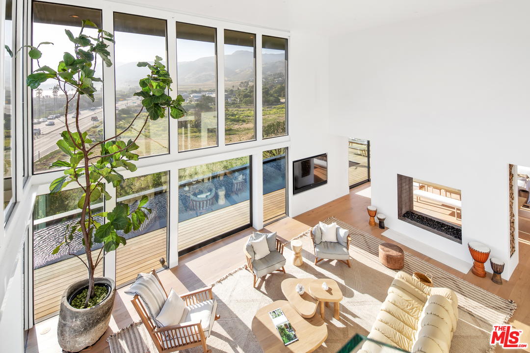 6463 Surfside Way Malibu, CA 90265 - Photo 9 of 31 a living room with a large window