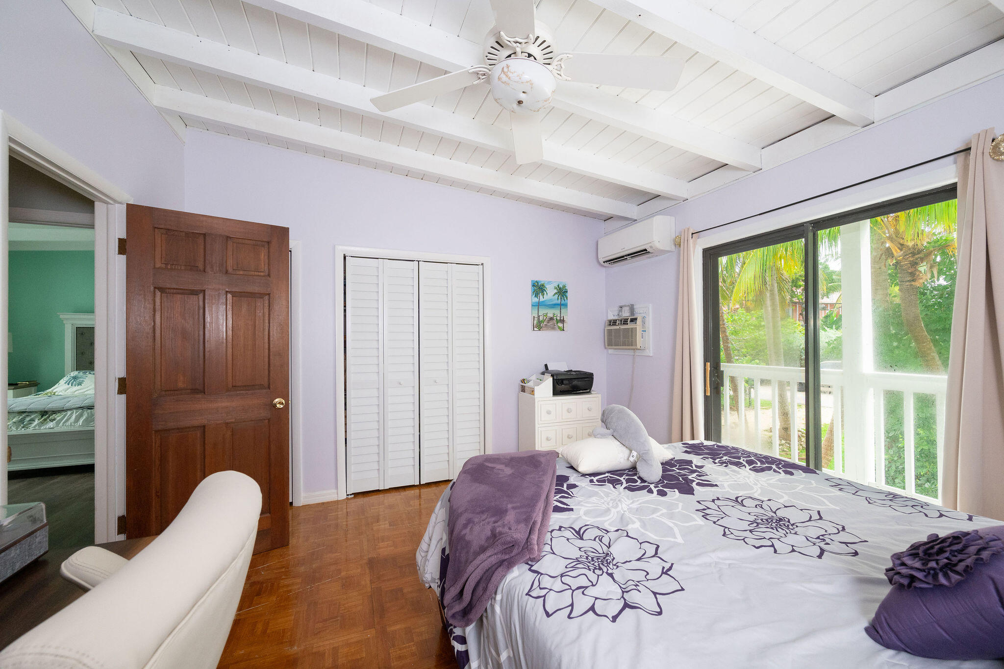 78 Bay Drive Key West, FL 33040 - Photo 30 of 116 a bedroom with a bed and glass windows