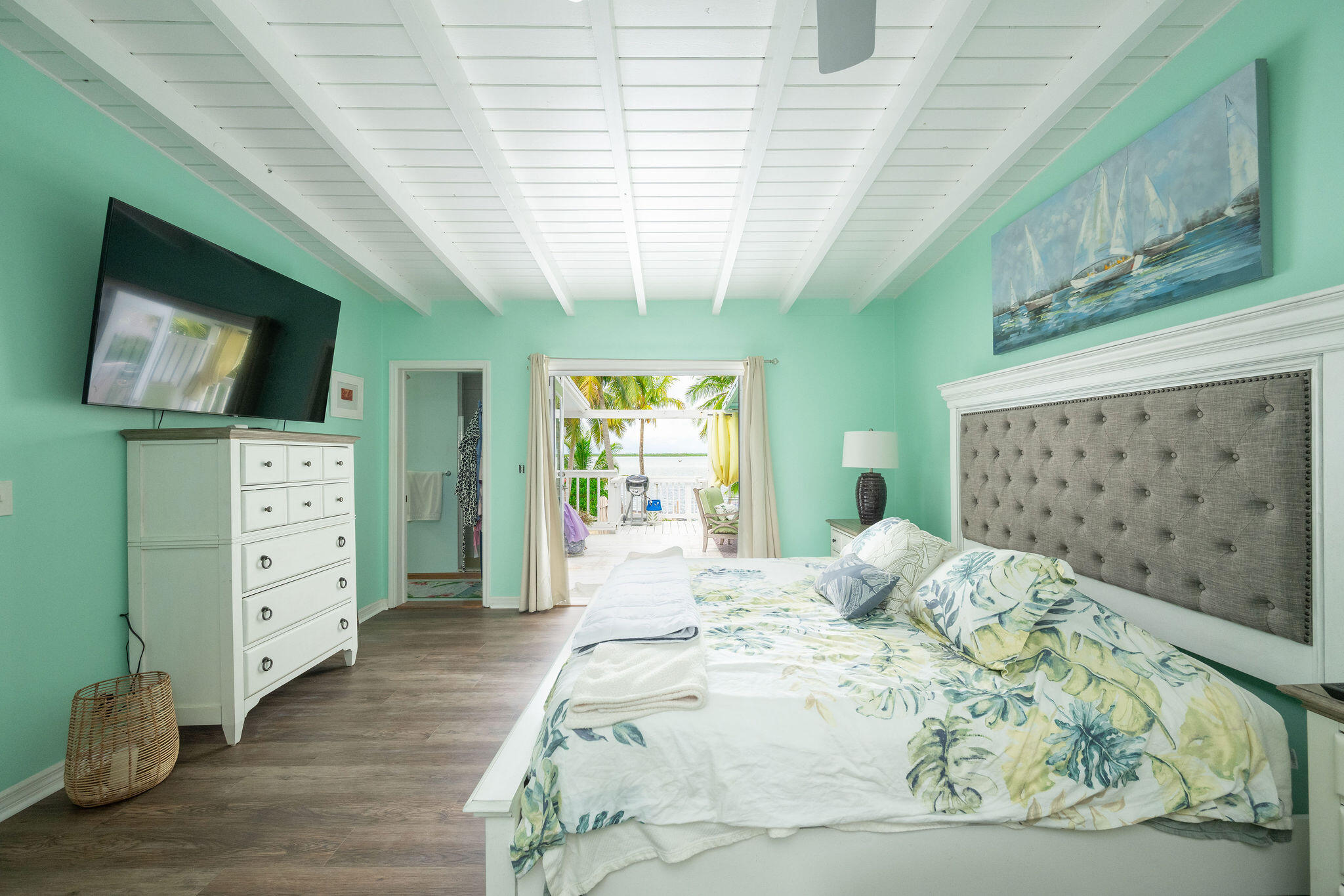 78 Bay Drive Key West, FL 33040 - Photo 36 of 116 a bedroom with a bed closet and flat tv screen