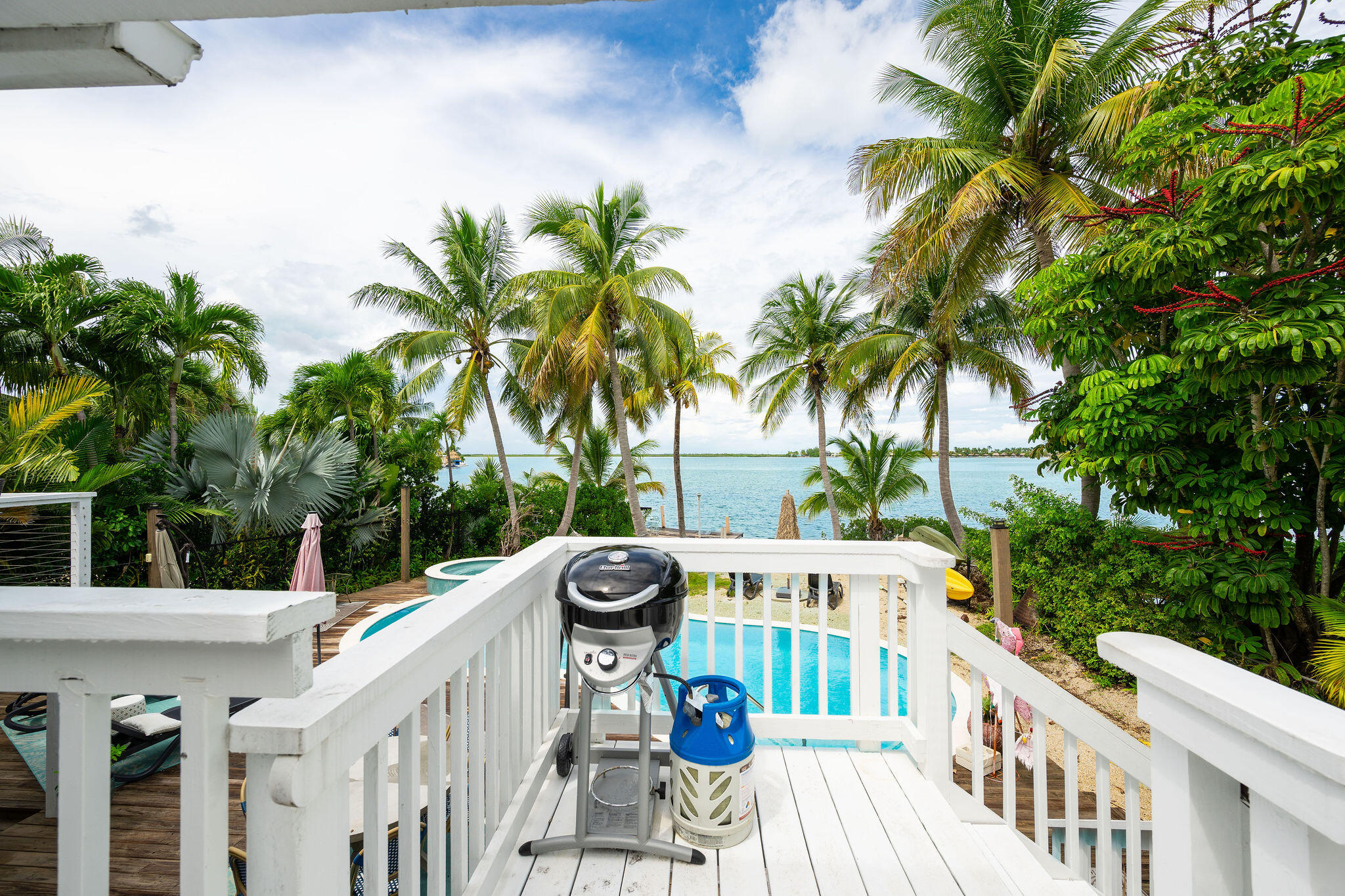 78 Bay Drive Key West, FL 33040 - Photo 39 of 116 a view of balcony with furniture and palm trees